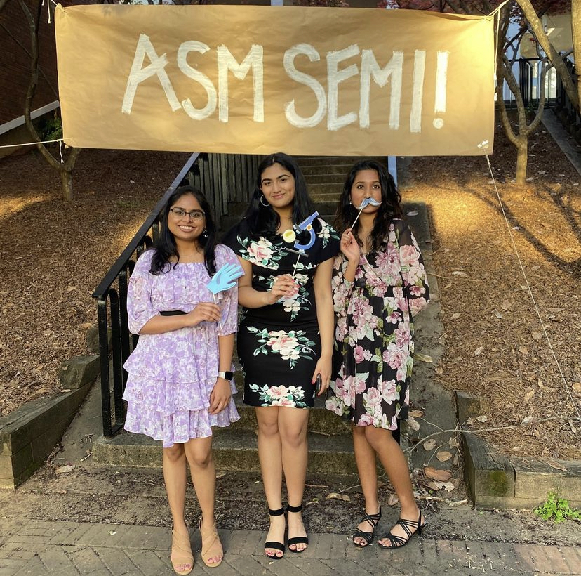 Three Microbiology students are posing before they go to the ASM semi formal